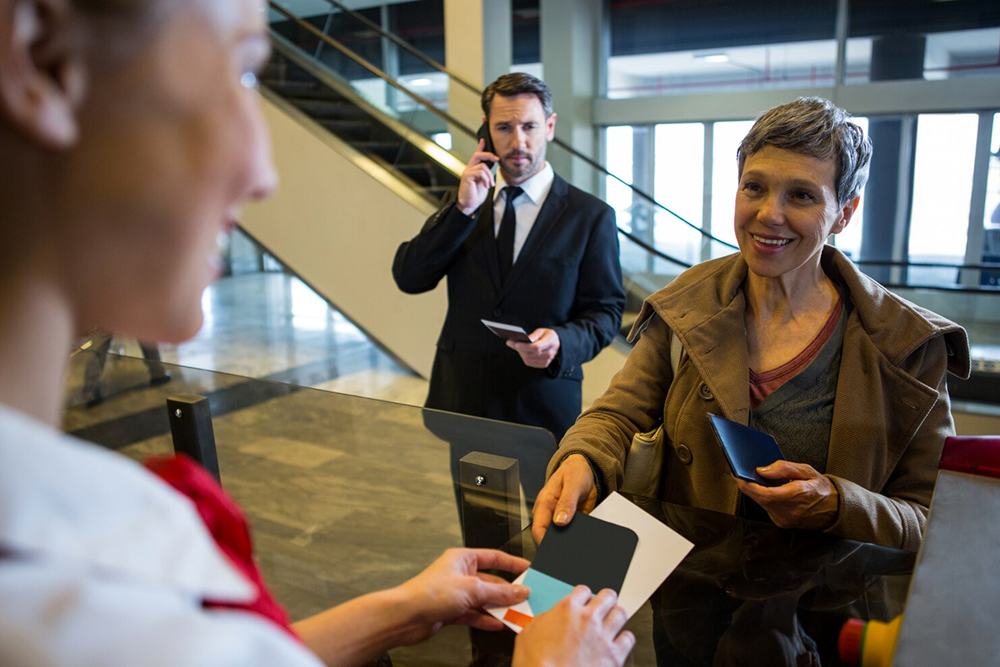 Skilled foreign worker reviewing Federal Skilled Worker Program eligibility requirements, including overseas work experience, language proficiency, education, and settlement funds